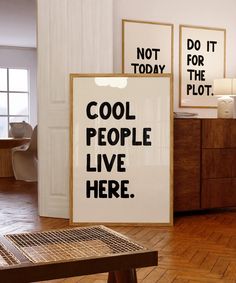 there is a sign that says cool people live here in black and white on the wall