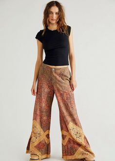 *********Free People These stunning pants are featured in a mid-rise, exaggerated wide-leg silhouette with vintage-inspired floral print and crochet lace piecing throughout. Zip fly and button closure Side pockets Relaxed, billowy, wide-leg fit Size 0 New with tags Hundreds of new Free People clothes, shoes and BAGS just listed. Lots of fabulous stuff! Modesty Journey, Howl Pendragon, Sweet Surrender, Flattering Pants, Hippie Fashion, People Clothes, Bell Bottom Pants, Fashion Wishlist, Free People Pants