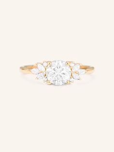 a three stone diamond ring in yellow gold