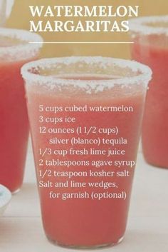 three cups filled with watermelon margaritas on top of a table