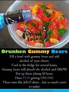 a bowl filled with gummy bears next to a bottle