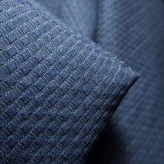 close up view of blue fabric textured material