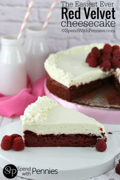 a slice of red velvet cheesecake on a plate with raspberries next to it