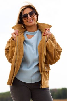 Complete any look with this stylish and comfortable jacket! -Color: Camel -Removable faux fur collared -Button down/ Zip up -Side flap pockets -Oversized silhouette -Content: 100% Cotton -Imported -Model is 5'5" 36-30-40 and wearing a size Small Trendy Winter Outerwear With Flap Pockets, Trendy Outerwear With Flap Pockets For Winter, Fall Outerwear With Padded Collar And Button-up Shape, Fall Button-up Outerwear With Padded Collar, Fall Corduroy Utility Jacket With Corduroy Collar, Fall Utility Jacket With Padded Collar For Workwear, Corduroy Outerwear With Corduroy Collar For Cold Weather, Beige Corduroy Outerwear For Work, Trendy Corduroy Winter Outerwear