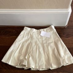 Brand New With Tags. Super Cute Beige Skort For Spring, Casual Summer Pleated Skirt With Short Inseam, Fitted Beige Mini Skirt, Casual Short Pleated Mini Skirt, Casual Short Pleated Summer Skirt, Fitted Cotton Short Pleated Skirt, Fitted Short Cotton Pleated Skirt, Short Fitted Cotton Pleated Skirt, Casual Pleated Skirt With Short Inseam For Spring