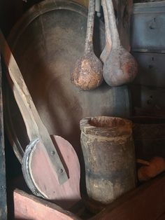 old wooden utensils and buckets are on display