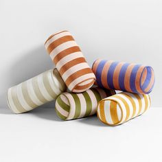 five striped vases stacked on top of each other