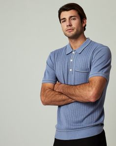 A pullover knitted sweater polo with complimentary contrast stitching at collar, pocket, sleeves, placket and bottom hem. Dress it up with a tailored jacked or keep it casual as you wear it solo. Details Models is 6'1" and wears a size medium. Care: Machine wash cold on delicate cycle with similar colors. Do not bleach. Do not tumble dry. Iron on low. Dry flat. Do not dry clean. Composition: 40% Viscose | 30% Recycled Polyester | 30% Nylon | 7DIAMONDS Men's Enzo Sweater Polo Shirt in Med Blue | Sweater Polo, Tailored Jacket, Knitted Pullover Sweaters, Hem Dress, Contrast Stitch, Knitted Sweater, Stripe Sweater, Lifestyle Brands, Knitted Sweaters