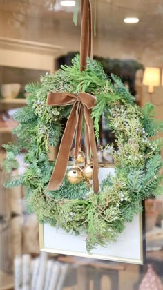 a christmas wreath hanging from the ceiling