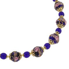 This classic and elegant Venetian glass necklace features a combination of simple small transparent beads in the shades of navy blue and larger exquisite beads adorned by raised decorations on the outside created in ancient Fiorato technique. This necklace is a shimmering work of art hand-made by Murano glass masters who have been perfecting their skills for generations. Wear it to demonstrate your unique style and discerning taste. Measurements: The necklace measures 16 inches in length and the Elegant Glass Beaded Necklace With Large Beads, Elegant Necklace With Large Czech Glass Beads, Elegant Glass Necklace With Large Beads, Elegant Glass Necklaces With Large Beads, Elegant Murano Glass Beaded Necklaces, Elegant Large Blue Beads, Elegant Blue Beaded Necklace With Large Beads, Elegant Blue Beaded Necklaces With Large Beads, Elegant Blue Large Beads