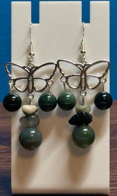 Beautiful moss agate dangle earrings. Made with sterling silver earwire and comes with earring backs. Be sure to check out the matching necklace and bracelet! I take pride in my work so if there are ever any problems with this piece, please let me know so we can get it fixed! I make one of a kind jewelry that will stand out! Will ship Quickly!! Matching Necklace And Bracelet, Nice Jewelry, Bracelet I, Necklace And Bracelet, Etsy Earrings Dangle, Matching Necklaces, Moss Agate, Earring Backs, Amazing Jewelry