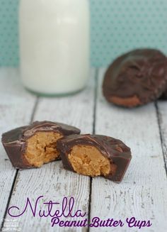 chocolate covered peanut butter cups next to a glass of milk