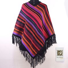 These ponchos are handmade by artisans from Cusco-Peru, a living Inca city. Our artisans who still preserve the traditional way weave by hand using Alpaca wool. Our very warm and cozy ponchos! ❤ With unique techniques and designs, these ponchos are handmade by Quechua artisans in the Andes. These luxurious wool ponchos are not only stunning and special but will keep you super warm in winter and fall. When cared for properly, these ponchos will last for years. The stunning and eye-catching design Bohemian Black Handwoven Poncho, Traditional Handwoven Poncho For Fall, Black Bohemian Handwoven Poncho, Handmade Artisan Poncho For Festivals, Handmade Black Poncho For Festivals, Handmade Alpaca Bohemian Poncho, Handmade Bohemian Alpaca Poncho, Bohemian Alpaca Shawl, Bohemian Alpaca Shawl One Size