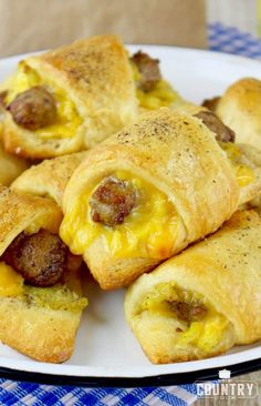 sausage and egg breakfast rolls on a white plate