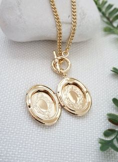 Gold locket necklace - oval locket pendant necklace, gold toggle necklace, curb chain necklace, locket charm necklace, photo holder necklace, gift for herDetails:----------- keep photos/messages of love ones close to your heart with this necklace- personalize this oval locket pendant by placing your own photo/message in the compartment- gold plated locket suspended on curb chain chain, finished with toggle claspDimension:--------------Locket: 32 mm x 21 mmChain length: 18 inchesPhoto opening : 2 Oval Locket Necklace, Locket Gold, Locket Jewelry, Necklace Photo, Necklace Locket, Keep Secret, Gold Locket Necklace, Pendant Locket, Oval Locket