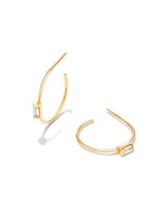 A modern variation on a classic design, the Isabella 14k Yellow Gold Hoop Earrings in White Diamond feature a solo baguette gemstone at the center of each silhouette. Designed to style for a lifetime, these timeless hoops are perfect for everyday and elevated enough for your most formal occasions.

We have taken steps to ensure that, when applicable, our diamonds are conflict free by requiring our suppliers to comply with the Kimberley Process. Baguette Gemstone, Baguette Diamond Earrings, Gift Me, Half Eternity Band, House Exteriors, Latest Trend, Yellow Gold Pendants, Christmas Wish, Baguette Diamond