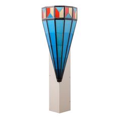 a tall blue lamp sitting on top of a white pedestal