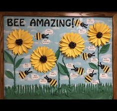 a bulletin board with bees and sunflowers on it