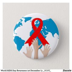 a button with a red ribbon on it and hands reaching up to the earth for help