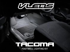 there is a black and white photo of the inside of a car with text that reads tacoma footwell lighting kit