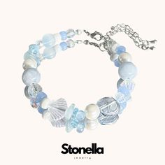 The "Ocean Tranquility" bracelet is designed to bring a sense of calm and peace to the wearer. Inspired by the serene beauty of the ocean, this bracelet symbolizes tranquility, clarity, and emotional balance. The soothing blue tones and ocean-themed elements evoke the peacefulness of the sea, encouraging the wearer to embrace inner calm and clarity. Elements: Blue Beads: Central to the bracelet, these beads symbolize calmness, clarity, and emotional balance. The various shades of blue evoke the Sea Theme Bracelets, Sea Themed Bracelet, Adjustable Ocean-inspired Beaded Bracelets With Lobster Clasp, Adjustable Light Blue Crystal Bracelet For Gift, Adjustable Ocean-inspired Bracelet As Gift, Adjustable Ocean-inspired Bracelet Gift, Adjustable Silver Ocean-inspired Bracelets, Silver Adjustable Ocean-inspired Bracelets, Adjustable Silver Bracelet With Ocean-inspired Style