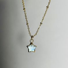 ✵Listing is for one necklace   ✵10x10 mm gold-plated Moonstone charm ✵24k gold plated satellite chain, 15-17.5 inches long and adjustable  ✵Please note: these gemstones are natural, therefore, will be unique in size, color, and texture. ✵Packaged in gold tissue paper with recyclable earring card holders, receipt included upon request  ✵Dainty, classy, & minimalistic style Get the matching set! Earring link down below:  https://www.etsy.com/listing/1368781592/moonstone-24k-gold-plated-star-celest Gold Star Jewelry For Gifts, Dainty Gold Crystal Pendant Necklaces, Delicate Star Shaped Jewelry For Gifts, Dainty Gold Plated Jewelry With Star Charm, Gold Clavicle Chain Crystal Necklace For Gift, Gold Dainty Jewelry With Star Charm, Dainty Gold Jewelry With Star Charm, Delicate Star-shaped Jewelry For Gift, Delicate Star-shaped Jewelry Gift