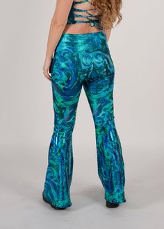 Be the raddest kitty at the festival in our most requested pants, the Groovy Bellbottoms! Made for booty-shaking, featuring a wide slimming waistband. Perfect flare while hugging every curve. Product Details 4-way stretch spandex blend Wide self stretch waistband Handmade in Brooklyn All items are made to order. Need a customization? Reach out to us HERE so we can provide you the perfect fit.