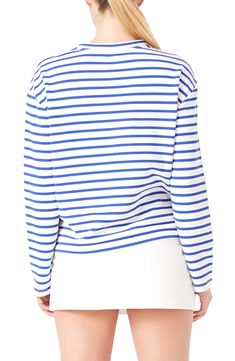 Shine bright in this striped long-sleeve top adorned with embellished patch letters decorating the front. Crewneck Long sleeves 65% cotton, 35% polyester Hand wash, dry flat Imported Fall Tops With Striped Cuffs And Relaxed Fit, Spring Cotton Sweatshirt With Contrast Stripes, Spring White Sweatshirt With Contrast Stripes, White Spring Sweatshirt With Contrast Stripes, White Contrast Stripes Sweatshirt For Spring, White Sweatshirt With Contrast Stripes For Spring, White Long Sleeve Sweater With Striped Hem, Spring Striped Sweatshirt With Contrast Stripes, Crew Neck Tops With Contrast Stripes For Fall