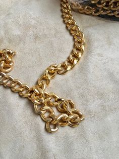 24x16 mm curb metal chain with a shiny, metallic gold finish. This iron chain features closely-knit linked chains that have subtle distresses carved into the metal Metal Chain, Metallic Gold, Link Chain, Gold Finish, Gold Metal, Beauty Book, Accessory Gift, Display Homes, Carving