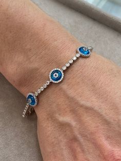 Silver Evil Eye Bracelet , Blue Stone Bracelet , Handmade Jewelry Bracelet , Good Luck Bracelet , 925K Sterling Silver Jewelry ,Gift For Him .. ★Item Details * Material : 925K Sterling Silver * Total weight : 10 Grams * Length : 18 Cm ✔ Ready to Ship in 1-2 Business Days .. ✔ Shipped to the Worldwide 1-5 business days with free shipping... ✔ The product will be sent to you with a handmade wooden box to avoid any damage during shipping... ✔ Visit our store, browse other Men's jewelry, silver and Blue Sterling Silver Bracelets, Blue Sterling Silver Round Bracelets, Silver Evil Eye Bracelets In Sterling Silver, Sterling Silver Evil Eye Bracelets, Sterling Silver Evil Eye Bracelet In Silver, Silver Hand-set Beaded Bracelets For Gift, Blue Sterling Silver Bracelet, Blue Sterling Silver Round Bracelet, Adjustable Blue Round Tennis Bracelet