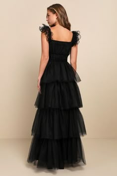 We're totally head over heels for the Lulus Tulle For Love Black Mesh Tulle Tiered Ruffled Maxi Dress and we think you will be too! Lightweight tulle and airy mesh come together to shape this stunning dress. Elasticized straps boast sculptural ruffled trim as they support a bodice with a square neckline (with hidden no-slip strips) and an empire waist. Skirt has a voluminous tiered design, finishing at a maxi hem. Hidden zipper/clasp at side. Fit: This garment fits true to size. Length: Floor le Black Tulle Gown, Black Tiered Dress, Black Tulle Dress, Lulus Dress, Tulle Maxi Dress, Black Bridesmaids, Black Tie Wedding Guests, Wedding Guest Attire, Banquet Dresses