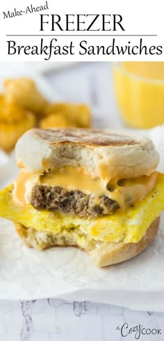 an egg and cheese breakfast sandwich with tater tots next to it on a white napkin