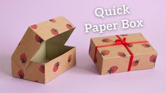 an open box with strawberries on it and the words quick paper box above it