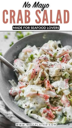 a bowl filled with crab salad on top of a table