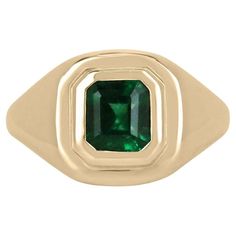 Introducing a captivating unisex emerald solitaire gold ring, featuring a striking 1.48-carat emerald of unparalleled beauty. The emerald boasts an intensely rich dark green color that commands attention, while its unique characteristics set it apart as a truly exceptional gem. Set within a luxurious 18k yellow gold bezel, this ring exudes a timeless elegance that appeals to both men and women, making it a versatile and coveted piece for anyone seeking to adorn their finger with a magnificent em Timeless Polished Emerald Ring, Timeless Yellow Gold Emerald Signet Ring, Fine Jewelry Emerald Cut Signet Ring With May Birthstone, Timeless Yellow Gold Signet Ring With Emerald, Fine Jewelry Emerald Cut Signet Ring For May Birthstone, Modern Emerald Ring In Yellow Gold With Center Stone, Yellow Gold Solitaire Emerald-cut Signet Ring, Emerald Solitaire Signet Ring In Fine Jewelry Style, Fine Jewelry Emerald Solitaire Signet Ring