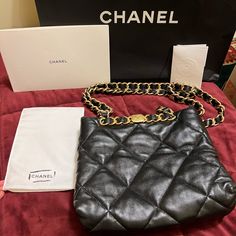 Gorgeous Chanel Small Shopping Bag In Black Lambskin With Gold Hardware. Very Lightly Used- Inside Is Pristine, With Original Plastic Wrap Still On Some Hardware. Minor Scuffs To The Outside Hardware From Normal Wear And Tear. Leather Is In Perfect Condition- No Visible Signs Of Use On Leather. Worn A Handful Of Times By My Mom But She Has Other Purses She Uses More. I Cross Post On Other Platforms Too, Sometimes For Less- Find Me There. High-end Evening Bag With Removable Pouch, Designer Shopping Bag With Chain Strap, Designer Bags With Chain Strap For Shopping, High-end Black Soft Leather Shoulder Bag, Luxury Shoulder Bag With Branded Hardware, High-end Black Pouch Bag, High-end Soft Leather Shoulder Bag For Evening, Luxury Black Evening Bag With Gold-tone Hardware, High-end Evening Tote Bag