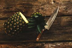 a pineapple with a knife on top of it