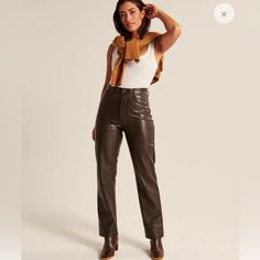 Ultra High Rise Pants In Our Luxe Vegan Leather Fabric, Featured In Our Curve Love 90s Straight Fit, With Functional Pockets And A Zipper Closure. Curve Love Features An Additional 2 Inches Through The Hip And Thigh From Our Classic Vegan Leather 90s Straight Pants. Imported. Faux Leather:90% Polyester, 10% Elastane / Coating:100% Polyurethane Brown Leather Pant, 90s Silhouette, Brown Leather Pants, Leather Pants Women, Leather Pant, Love Jeans, Stylish Pants, Abercrombie And Fitch Jeans, High Rise Pants