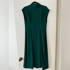 Never Worn, Beautiful Zara Woman Midi Dress, Perfect For Any Elevated Occasion With Heels Or Dressier Work Look, Emerald Green, Two Front Pleats With Flow, Sleeveless With Wider Shoulder Width And Mock Neck. Really Pretty! Size S, Flowy Bottom - I’m 5’8” And It Would Hit Me Mid-Calf Green Sleeveless Maxi Dress For Work, Green Stretch Midi Dress For Work, Spring Classic High Neck Dress, Classic High Neck Spring Dresses, Fitted Green Midi Dress With High Neck, Green Fitted High Neck Maxi Dress, Zara Classic Workwear Dresses, Fitted High Neck Green Maxi Dress, Zara Green A-line Maxi Dress