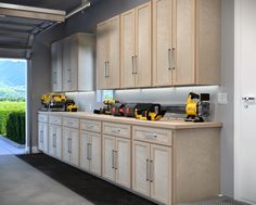 a kitchen with lots of cabinets and power tools