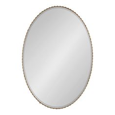 a round mirror with rope trim around the edges and an oval frame, on a white background