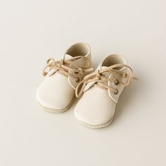 Add a touch of sweetness with our Baby Boots in Almond. These neutral soft-soled shoes are the perfect addition to any baby's wardrobe. The zero drop soles are a coordinating sand suede and bend with every move little feet will make. Details: uppers are vegetable-tanned soles are sand suede (not vegetable-tanned) walker sole is 2mm flexible rubber added to suede soles. Recommended for outdoor use. Care: use saddle soap and leather conditioner as needed. You have your choice of laces, and if you'd like to add more to your order, find laces here. See Size chart. Because of the nature of this vegetable-tanned leather, there may be more pebbling than pictured. Spring Playtime Booties With Rubber Sole, Cute Cream Non-slip Booties, Cream Moccasins With Rubber Sole And Round Toe, Cute Leather Spring Booties, Beige Round Toe Booties With Rubber Sole, Beige Booties With Rubber Sole And Round Toe, Cute Cream Booties With Soft Sole, Playtime Lace-up Booties With Rubber Sole, Cream Booties With Soft Sole For Spring