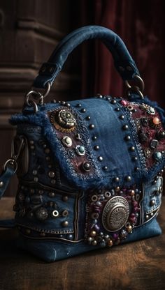 a blue purse sitting on top of a wooden table