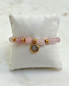 ✨This Saint Benedict Stretch Bracelets is made of following: Size and Material: - 8mm rose quartz stone beads bracelet and gold spacer beads, all strung on a durable elastic band - In the center is a 0.5-inch reversible St. Benedict silver and gold-finish medal. - The bracelet is approximately 7 inches in length - includes a 6mm gold beads stretch bracelet 💫Experience spiritual protection with our Saint Benedict medal bracelet, guarding against temptation. Get yours soon!  💝 Ready to Gift: This bracelet arrives in a beautiful gift box, just like the one pictured! 🌸 Jewelry Care: - Roll bracelets on and off gently to maintain their shape. - Apply cosmetics, lotions, and perfumes before wearing your jewelry. - Remove jewelry before swimming, bathing, exercising, gardening, and sleeping. - Pink Adjustable Rosary Bracelet For Healing, Adjustable Pink Rosary Bracelet For Healing, Rose Gold Bracelets With 8mm Beads For Gift, Rose Gold 8mm Beads Bracelet For Gift, Rose Gold 8mm Beads Bracelet As Gift, Spiritual Rose Gold Bracelets With 8mm Beads, Spiritual Rose Gold Bracelet With 8mm Beads, Gold Bracelets With Rose Quartz And Natural Stones, Adjustable Rose Quartz Stretch Bracelet Gift