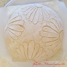 a round cake sitting on top of a white plate