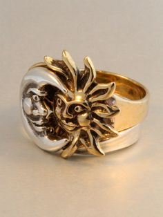 The Eclipse Ring is a striking two part ring set. The silver moon nestles into the golden rays of the bronze sun. The contrast of the two metals is striking and appropriately, the sun is cast in bronze and the moon is cast in sterling silver. We have many ring sizes immediately available. We will contact you to let you know if we have your chosen ring size in stock or when to expect shipment. Our bronze jewelry is antiqued lightly, and bronze will tarnish, or patina over time. To maintain the go Gold Crescent Ring With Sun And Moon Design, Gold Rings With Sun And Moon Design, Symbolic Gold Rings With Sun And Moon Design, Mystical Crescent Rings With Sun And Moon Design, Mystical Gold Rings With Sun And Moon Design, Mystical Moon-shaped Gold Rings, Sun And Moon Rings, Ring Moon, Sun Ring