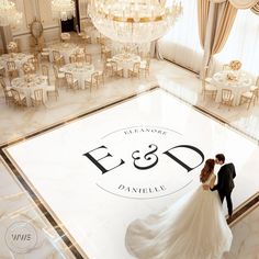 a bride and groom standing on the floor in front of an e & d logo