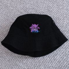 ゲンガー means Gengar in Japanese. A great gift or piece for everyday wear. Direct embroidery, only available here at Embroidered Dad Hats! * Embroidered on a cotton bucket hat. * Small-Medium is 22" and Large-XL is 23.5" circumference. * Embroidered in Dallas, Texas. * Free poly-bag shipping in US (more options at checkout). More styles: Dad Hat https://www.etsy.com/listing/988087326 Beanie https://www.etsy.com/listing/1320519670 If you like this, check out our small shop: https://www.etsy.com/shop Embroidered Bucket Hat, Cotton Bucket Hat, Bucket Hat White, Bucket Hat Black, 90s Anime, Hats For Sale, Poly Bags, Bucket Hats, Dallas Texas