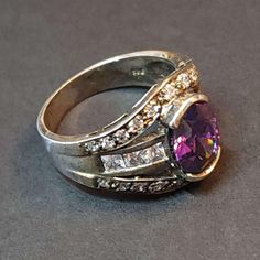 Vintage Size 8 Sterling Silver Ring, Amethyst CZ Statement Ring February Birthstone, Oval Purple CZ Ring Birthday Gift This is a spectacular vintage ring with beautiful craftsmanship.  This ring is from 2000 or earlier. It's in great condition, unworn, antiqued and tarnished. It's been in storage all of these years. AMETHYST CZ is the birthstone for February. All vintage sterling silver jewelry may have antiquing or tarnish. See all of our amethyst jewelry here: https://www.etsy.com/shop/BlueMoo Oval Amethyst Ring With Accent Stones For Anniversary, Purple Oval Crystal Ring With Gemstone, Oval Amethyst Cubic Zirconia Ring, Oval Amethyst Ring With Cubic Zirconia, Fine Jewelry Purple Oval Crystal Ring, Dazzling Oval Stone Setting Rings, Oval Purple Amethyst Ring With Cubic Zirconia, Oval Dazzling Rings With Stone Setting, Oval Purple Birthstone Ring With Center Stone