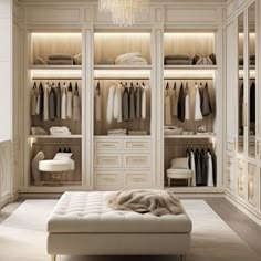 a walk in closet filled with lots of white furniture and clothes hanging on the walls